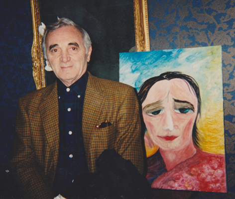 Charles Aznavour with his portrait by Jenny Batlay